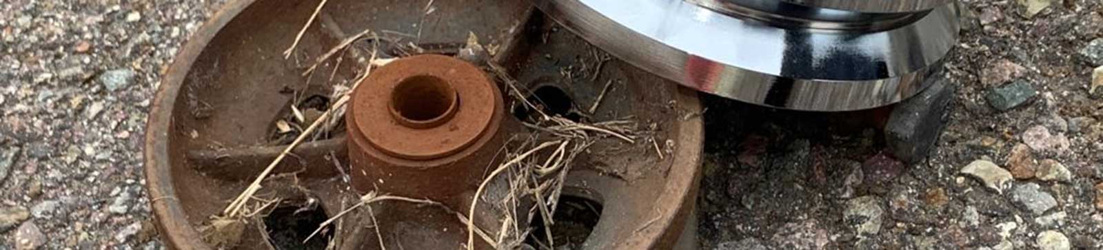 Replacement of old rusty garage cable drum with new precision-machined drum